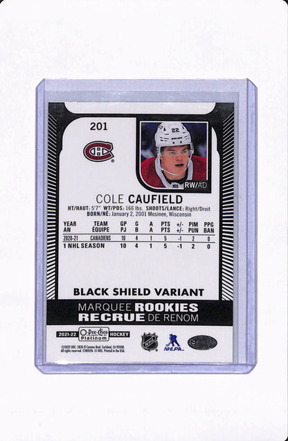 2021-22 O.P.C PLATINUM COLE CAUFIELD MARQUEE ROOKIES BLACK SHIELD VARIANT
