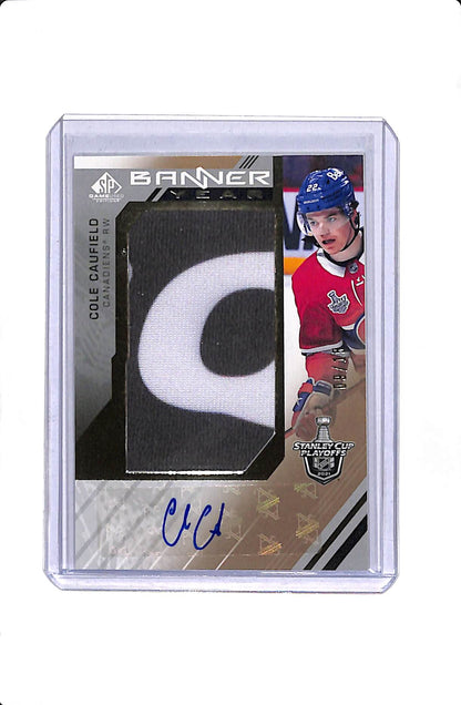 2021-22 UD SP GAME USED STANLEY CUP PLAYOFF BANNER YEAR COLE CAUFIELD ROOKIE AUTO /15